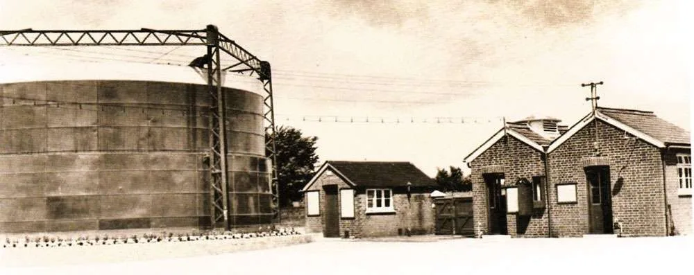 A gasholder and some of the buildings