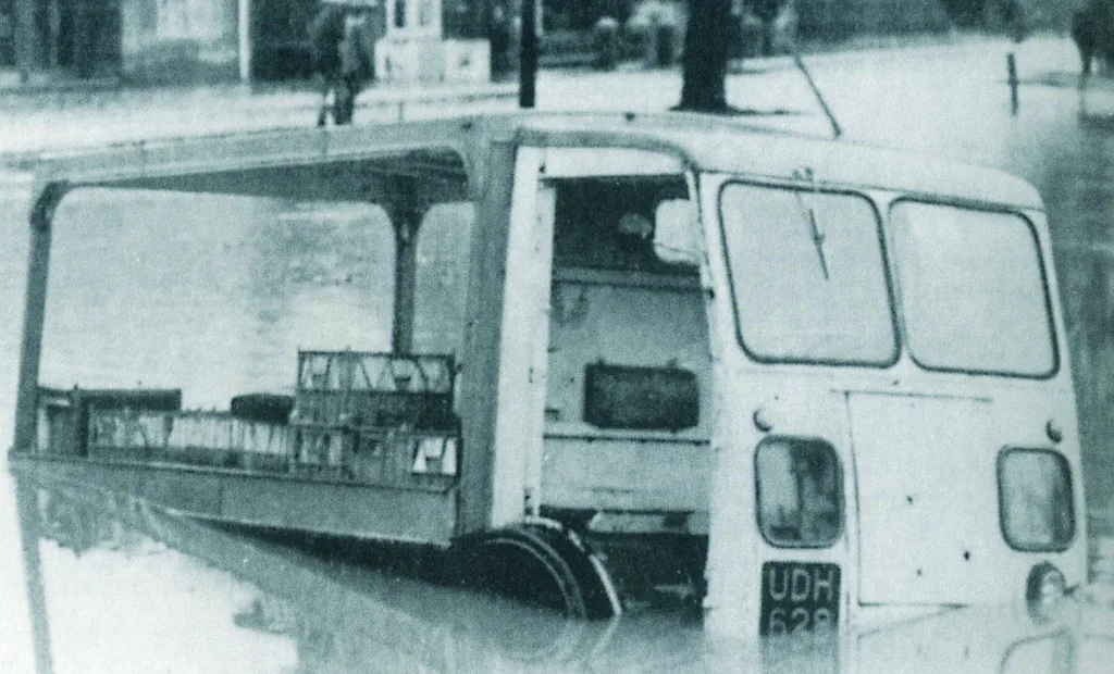 The milk float of George Puttock, in the pond on the Common
