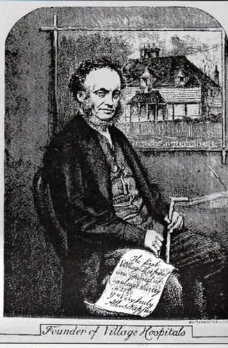 Dr Napper with a picture of the first village hospital in the country