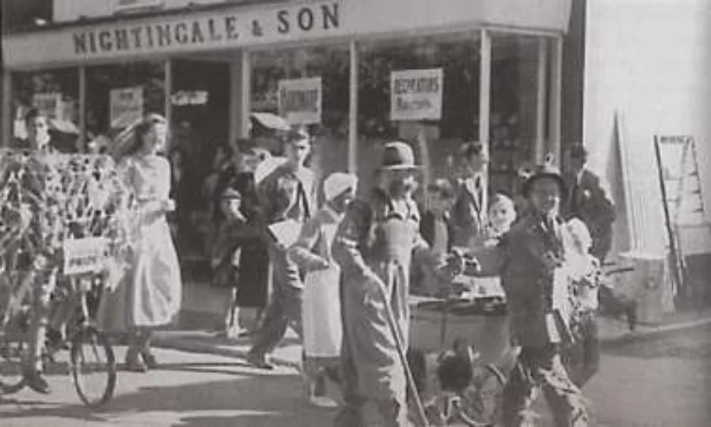 The Carnival procession of 1950 passing Nightingales furniture shop