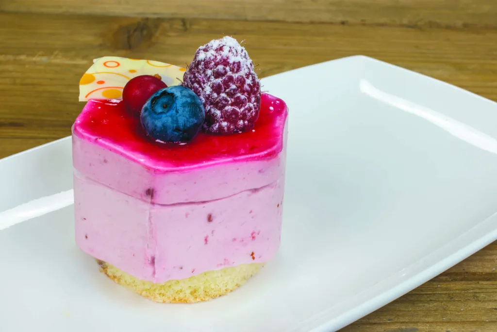 Delicious dessert: Bavarian cream with red and blue berries on a