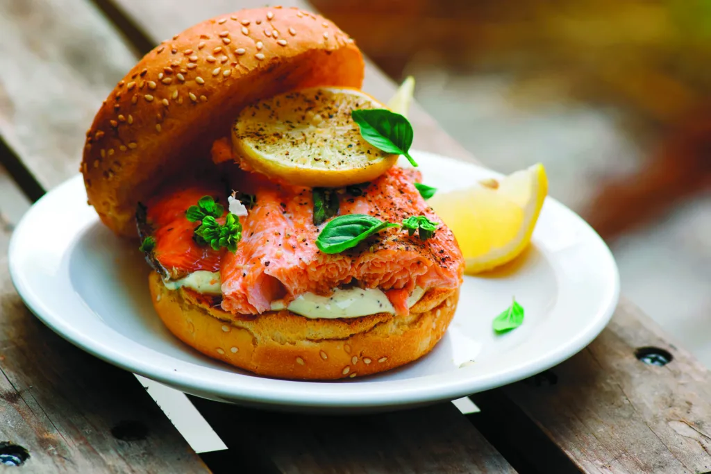 Fish burger with herb and lemon sauce.
