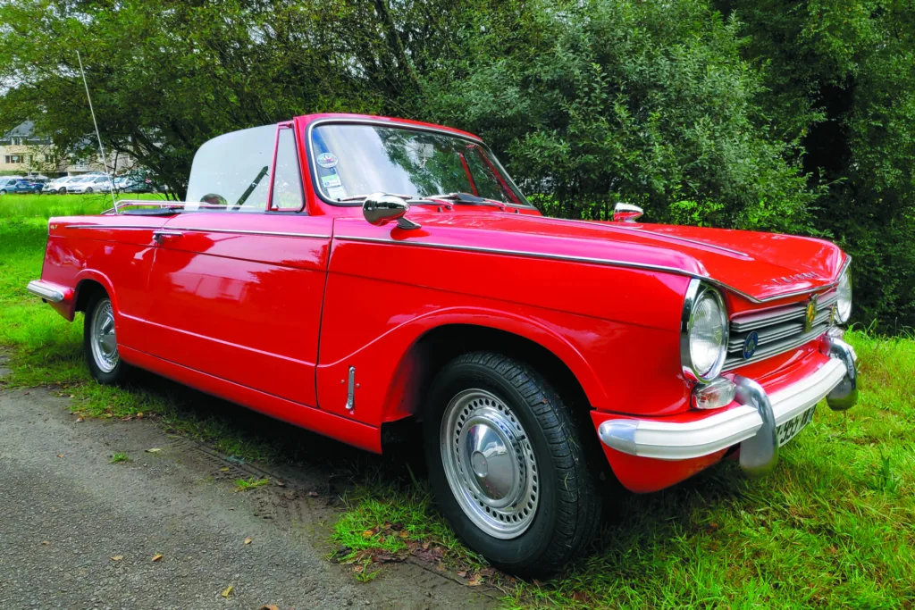 Red Triumph Herald convertible
