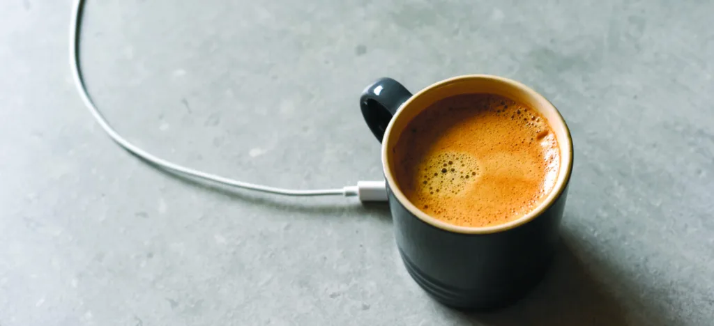 Concept for charging mobile device by sharing charge from caffin