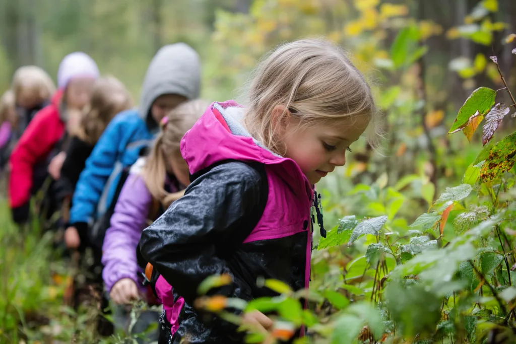 Kids exploring nature during an educational outdoor learning event in the forest
