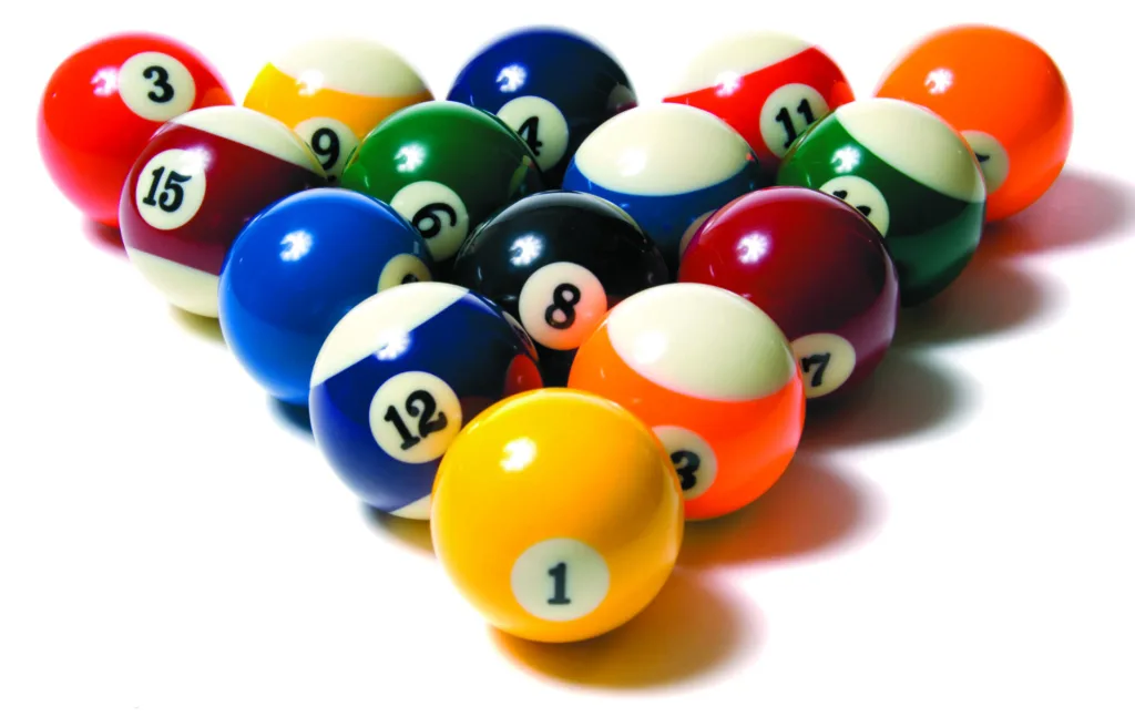 A group of colorful pool balls on a white background
