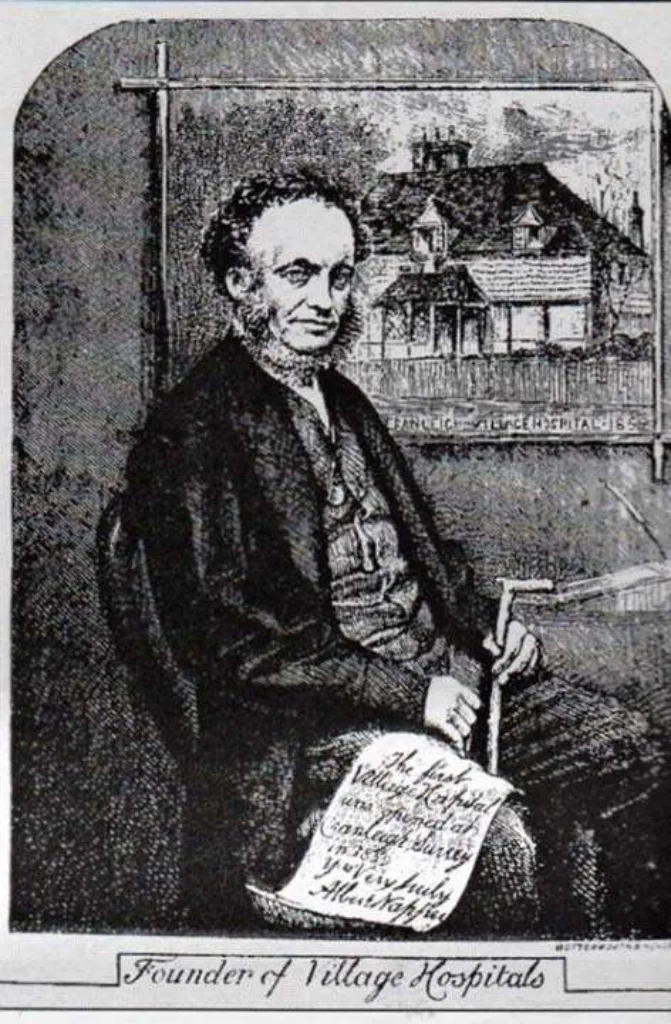 Dr Napper with a picture of the first village hospital in the country