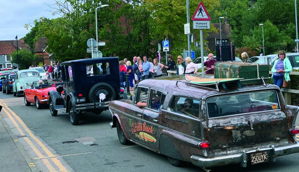 A line of gleaming classic cars on show at the Cranleigh Lions Classic Car Festival