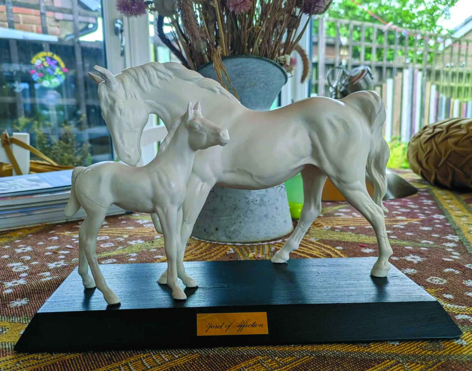 The ceramic horse pieced back together after repair