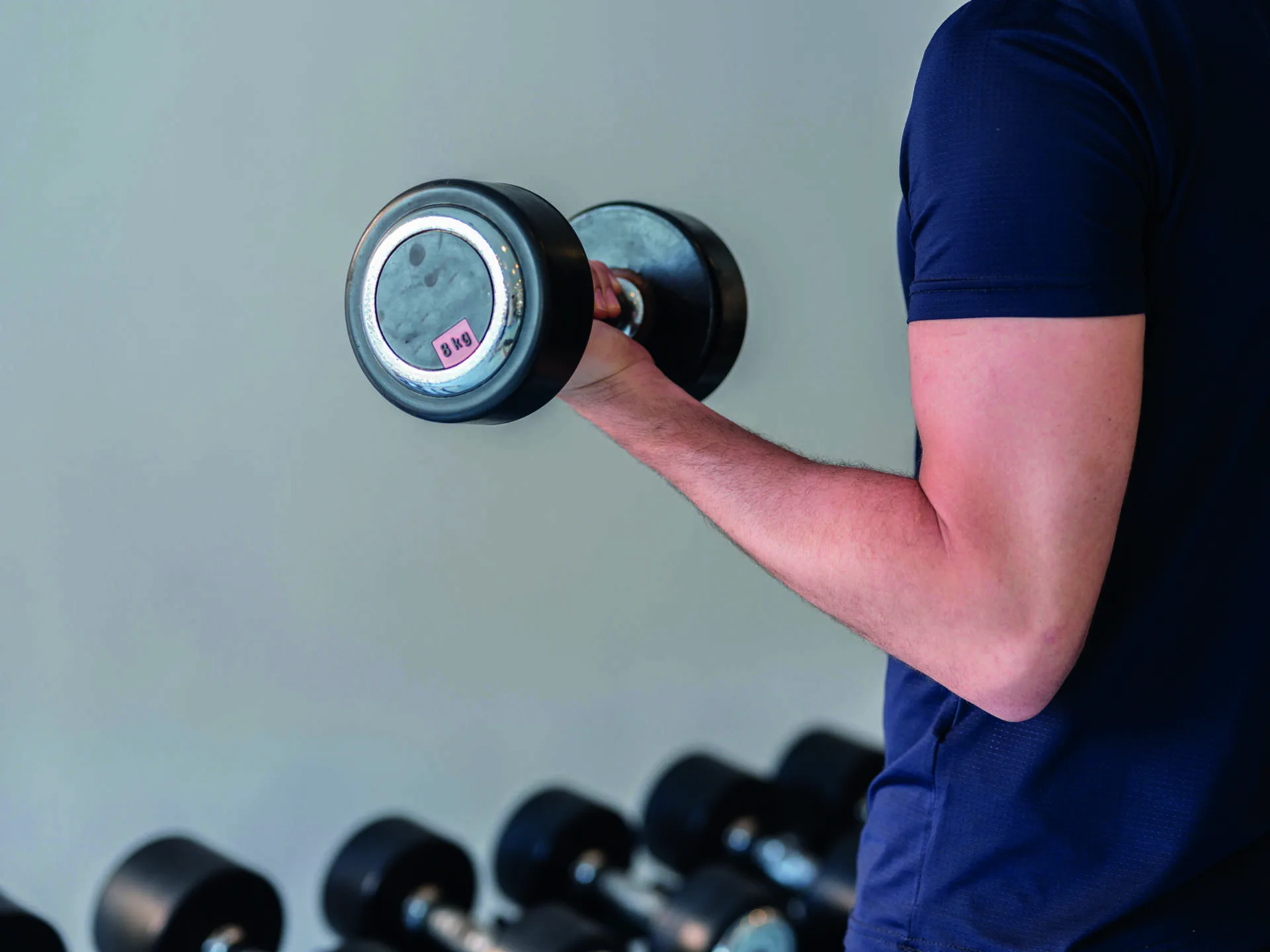 A person lifting a dumbbell during exercise