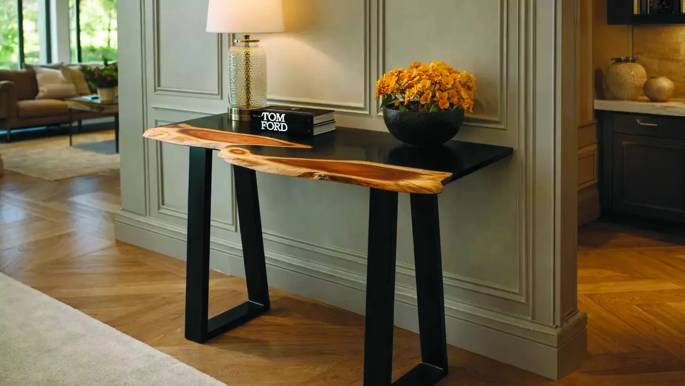 A bespoke live-edge console table by The Wood Cave, a natural timber top on black steel legs