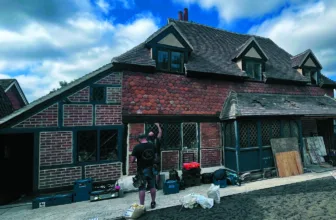 The medieval Napper Centre cottage under restoration in mid-July, with workmen at the front