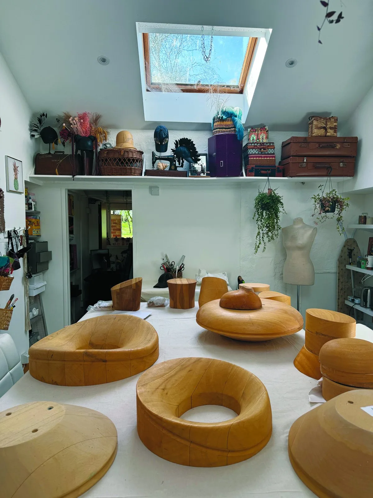 Wooden hat blocks used for sculpting hats in the studio
