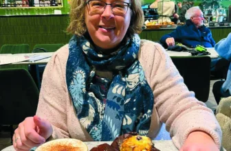 Sue, a member of Bosom Friends, enjoying a coffee