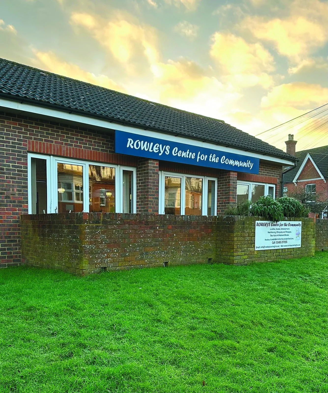 The Rowleys Centre for the Community building in Cranleigh, with its blue sign above the windows