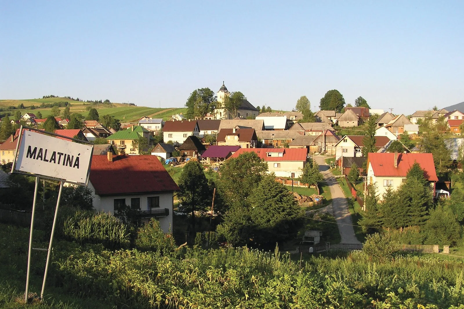 The village of Malatina in Slovakia, with a village name sign in the foreground