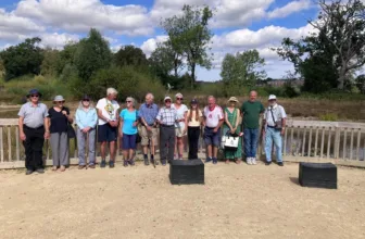A group of Memory Lane guests standing together on a walk in Knowle Park