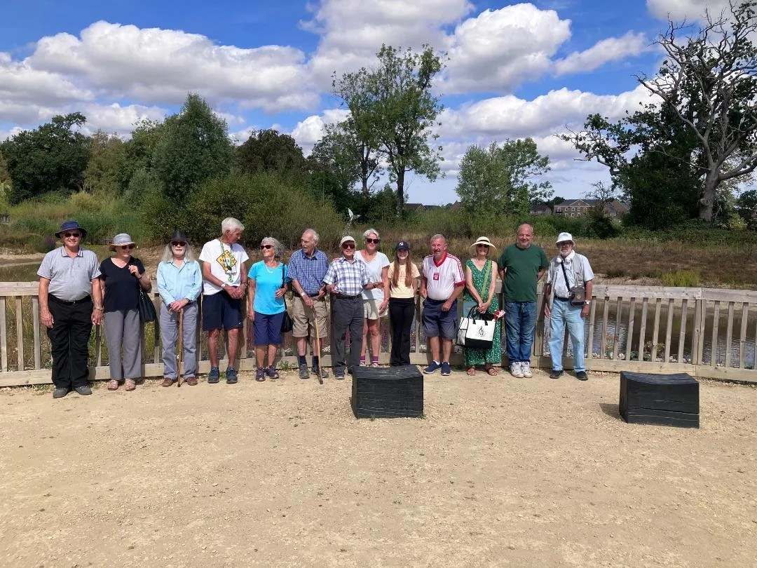 A group of Memory Lane guests standing together on a walk in Knowle Park