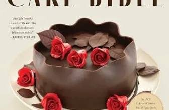 The cover of The Cake Bible by Rose Levy Beranbaum, showing a chocolate cake decorated with red roses